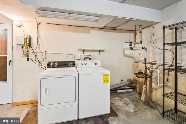 a view of small yard with white fence