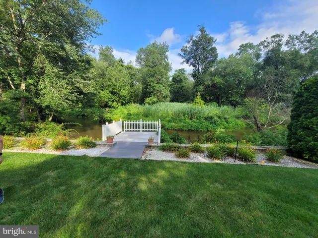 a view of a garden with houses