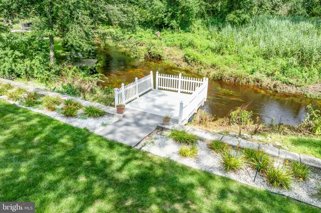 a view of lake with green space