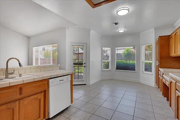 a view of an empty room with a fireplace
