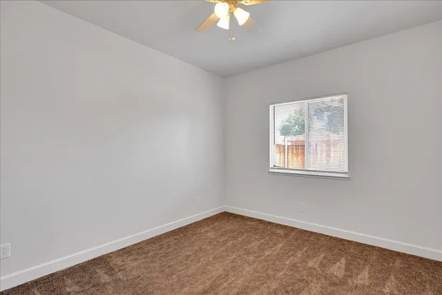 a bathroom with a granite countertop sink a toilet and bathtub