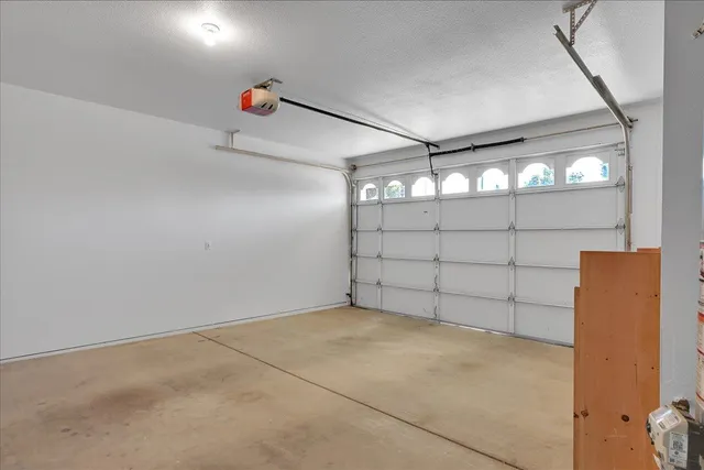 a view of a house with a yard and a garden