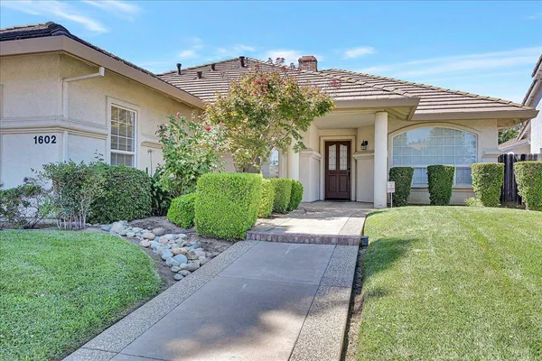 front view of a house with a yard