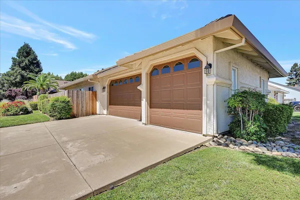 a view of backyard with garage