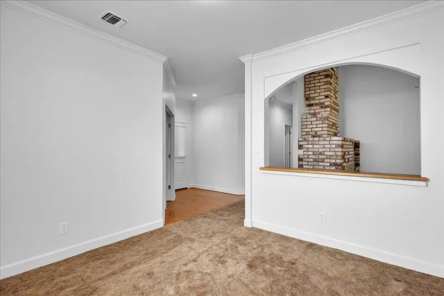 a view of a kitchen with a sink and a window