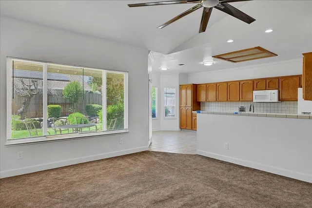 a kitchen with a sink cabinets and window