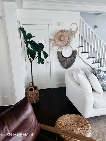 a living room with furniture and a rug