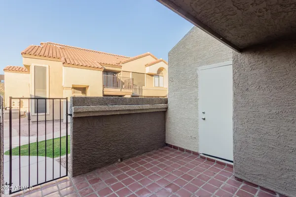 a view of a chairs and table in the patio