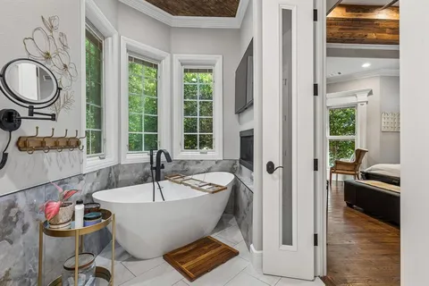 a bathroom with a bathtub and a sink