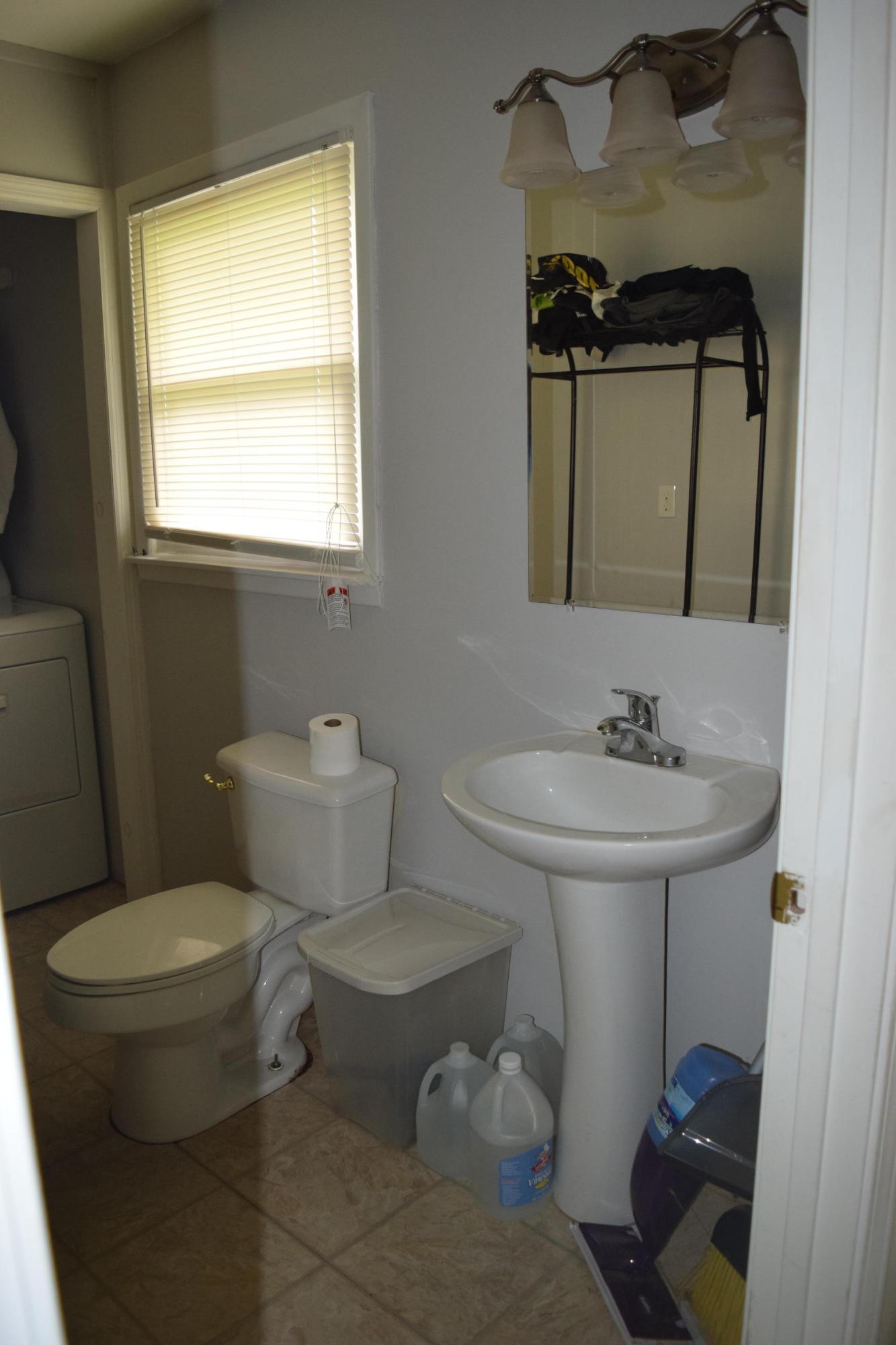 722 Kodak Road Kodak, TN 37764 - Photo 8 of 30 a bathroom with a sink toilet and a mirror