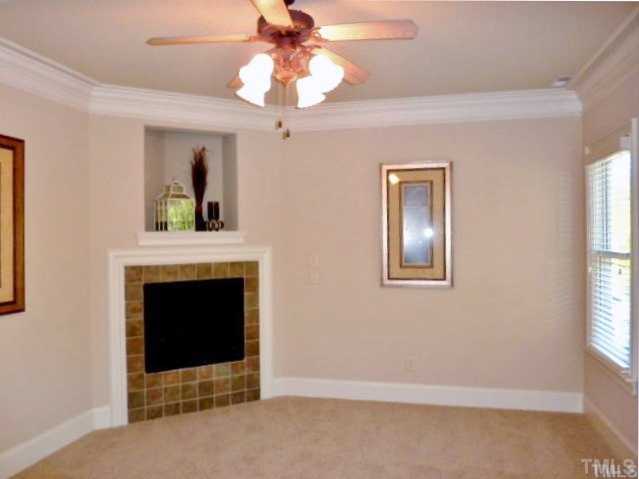 3706 Congeniality Way Raleigh, NC 27613 - Photo 9 of 10 a living room with furniture and a fireplace
