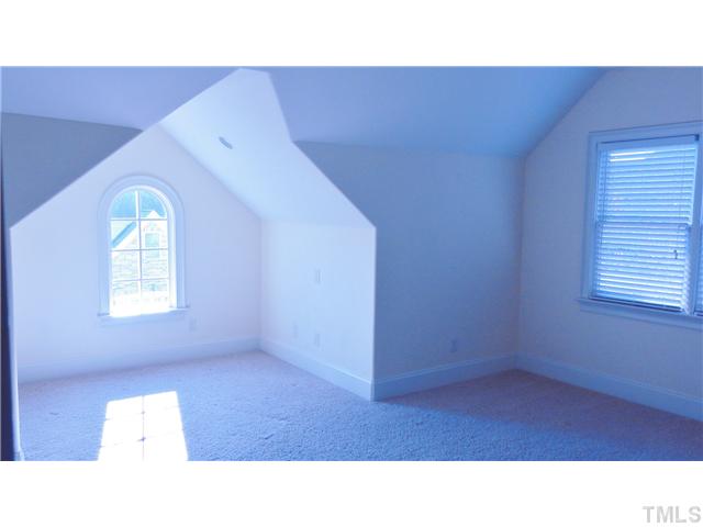 3706 Congeniality Way Raleigh, NC 27613 - Photo 10 of 10 a open hall with a cabinet