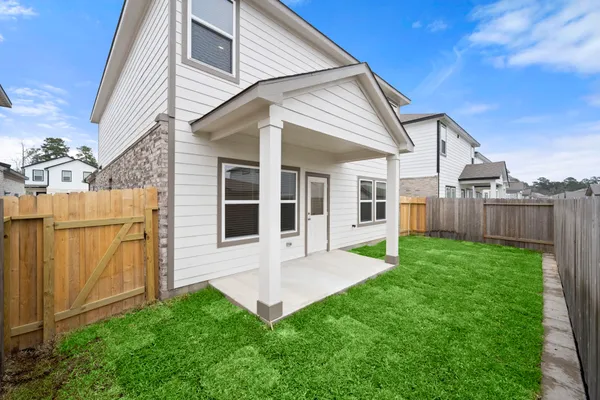 a view of an house with backyard porch and furniture