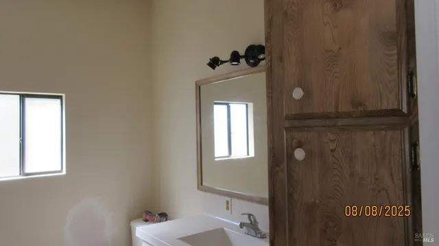 a bathroom with a sink and mirror