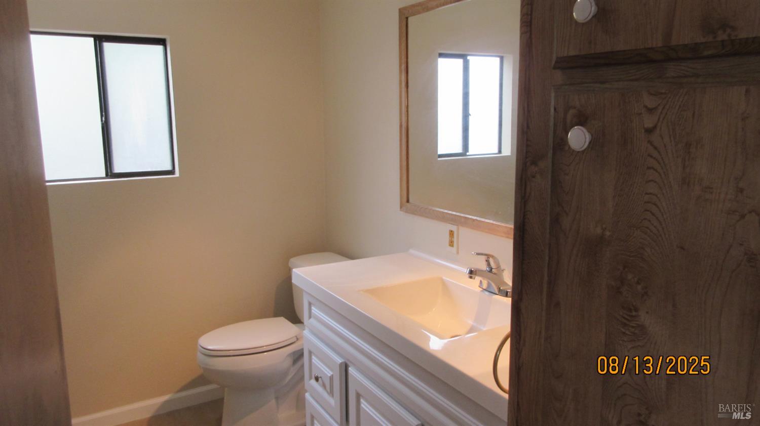 190 Apple Lane Santa Rosa, CA 95407 - Photo 6 of 15 a white toilet sitting next to a bathroom sink