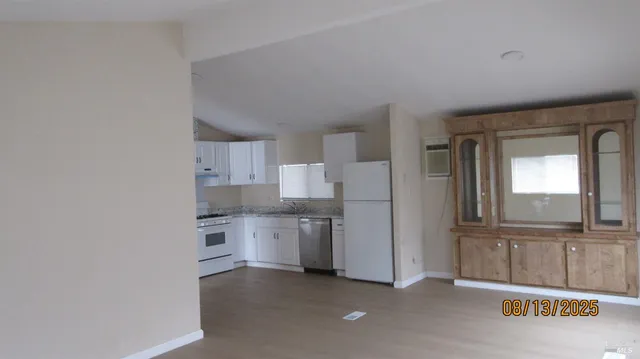 a view of a kitchen with a sink