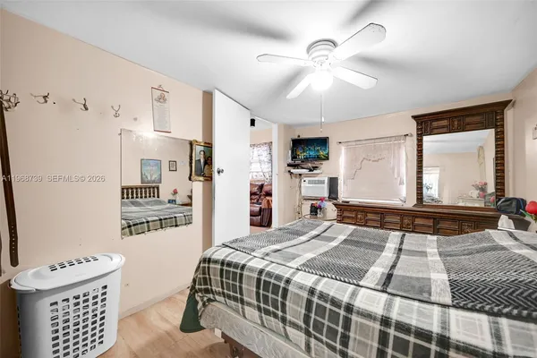 a bedroom with a bed and a walk in closet