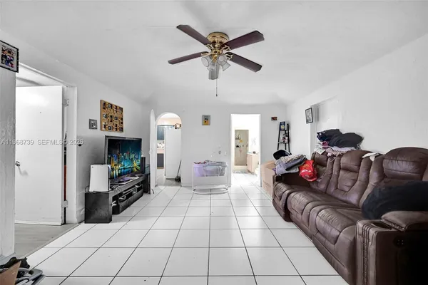 a living room with furniture and a flat screen tv