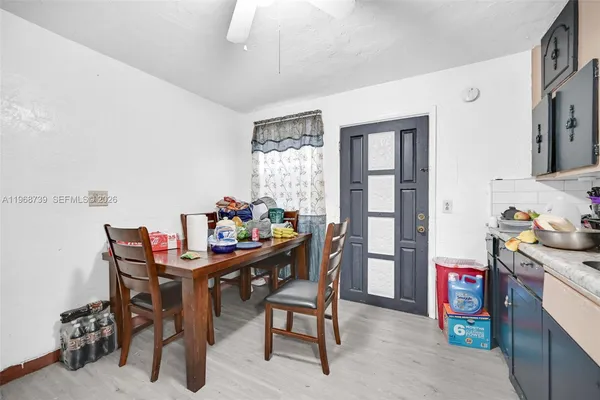 a dining room with furniture and window