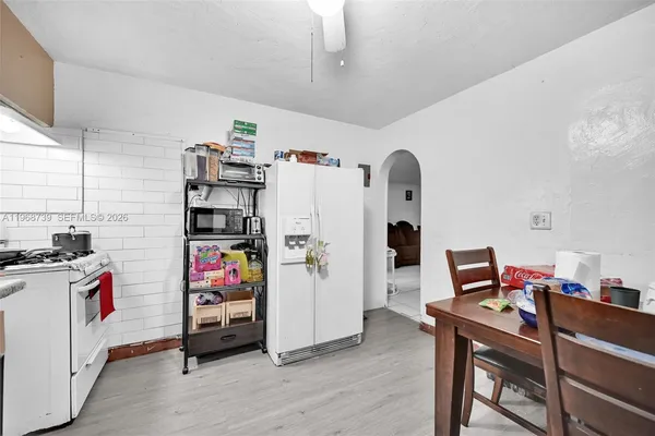 a workspace with furniture and wooden floor