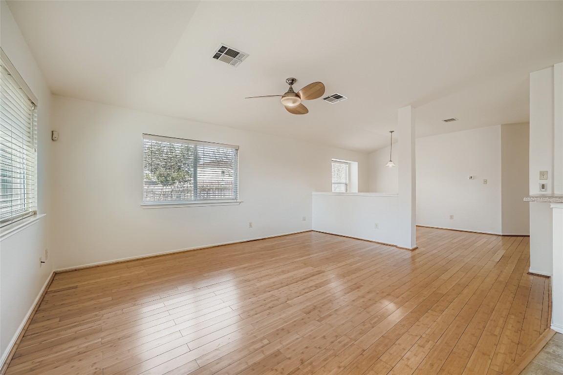 1101 Tudor House Road Pflugerville, TX 78660 - Photo 6 of 32 Spacious living room open to kitchen with great light
