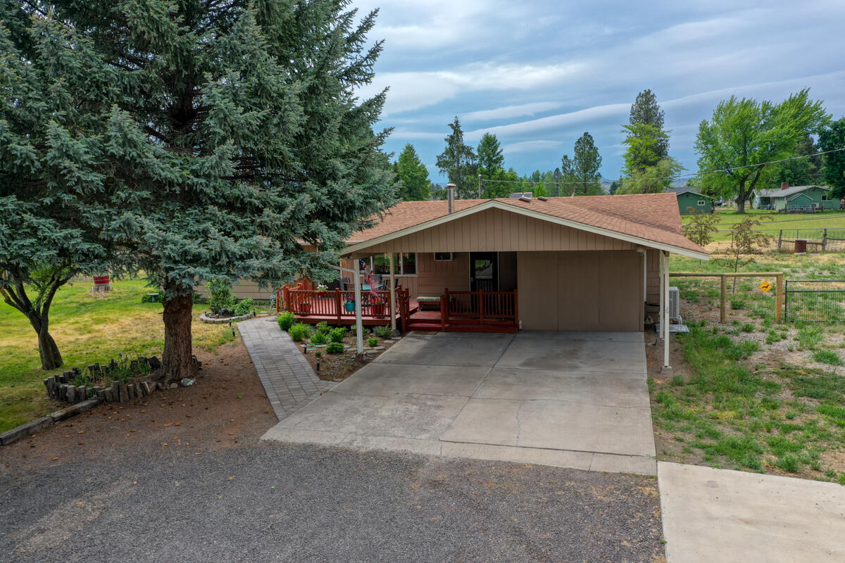 566 Northwest Mc Donald Road Prineville, OR 97754 - Photo 4 of 41 a view of a house with a yard and sitting area