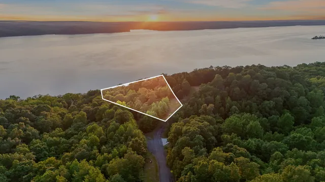an aerial view of house with ocean view