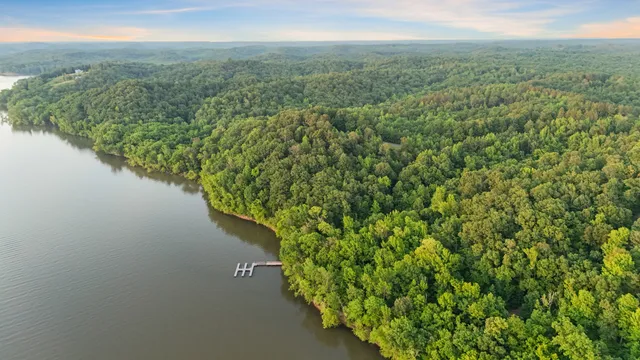 a view of a lake with a yard