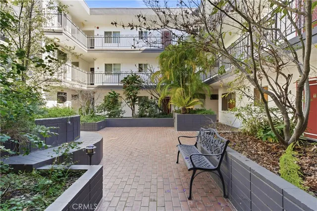 a view of a patio with furniture and a yard