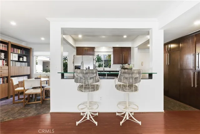 a living room with lots of dining room and wooden floor