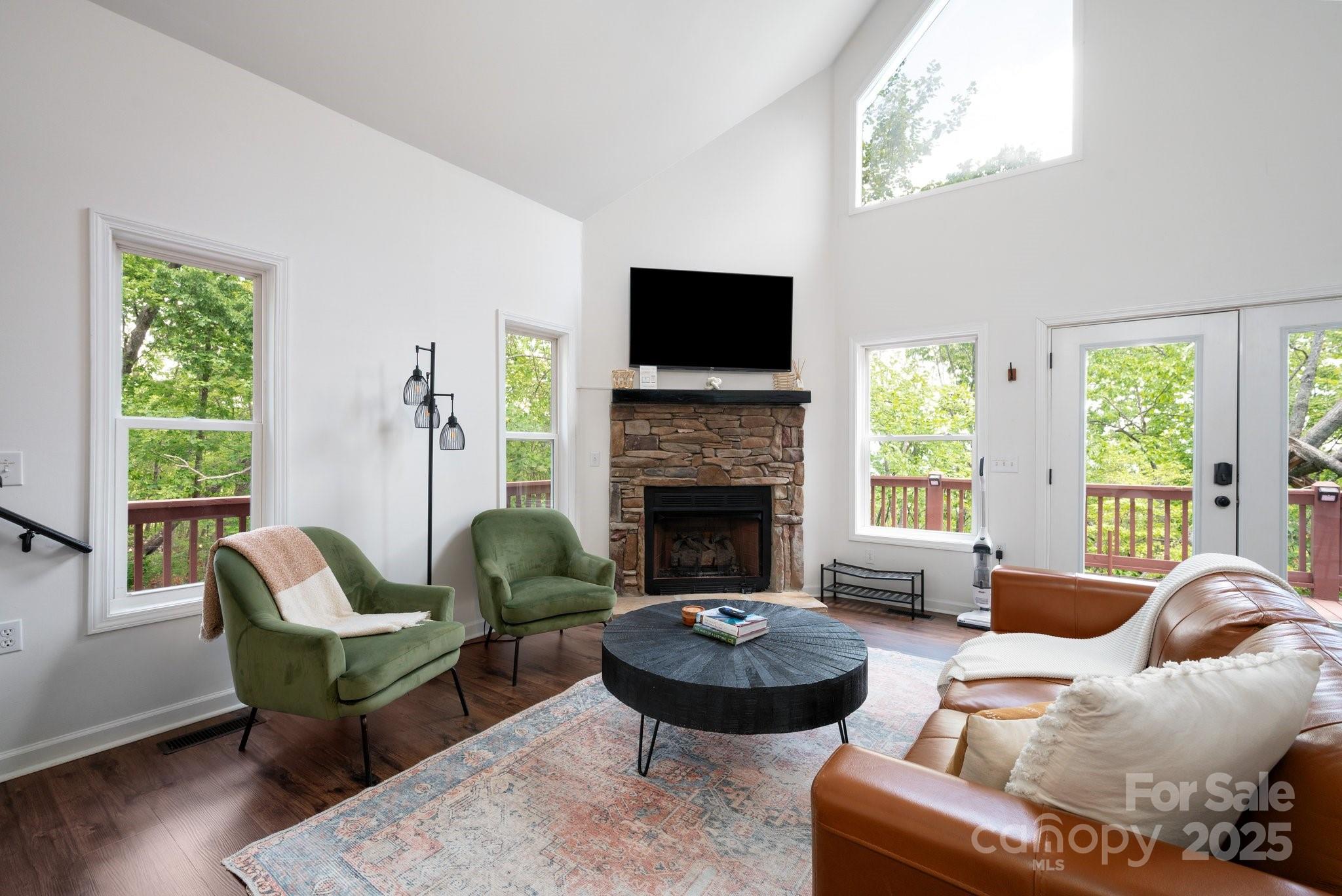 25 Lick Log Ridge Fairview, NC 28730 - Photo 14 of 34 a living room with furniture and a fireplace