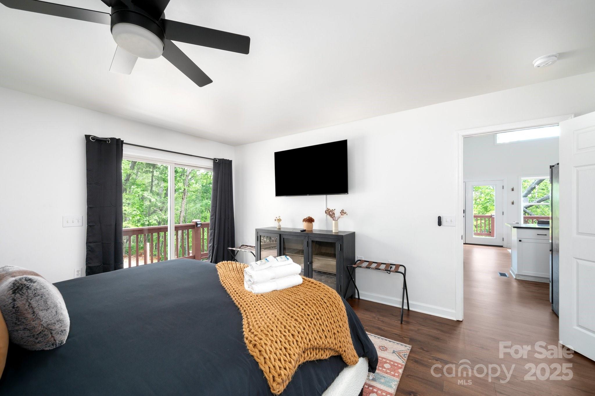 25 Lick Log Ridge Fairview, NC 28730 - Photo 16 of 34 a living room with furniture and a flat screen tv