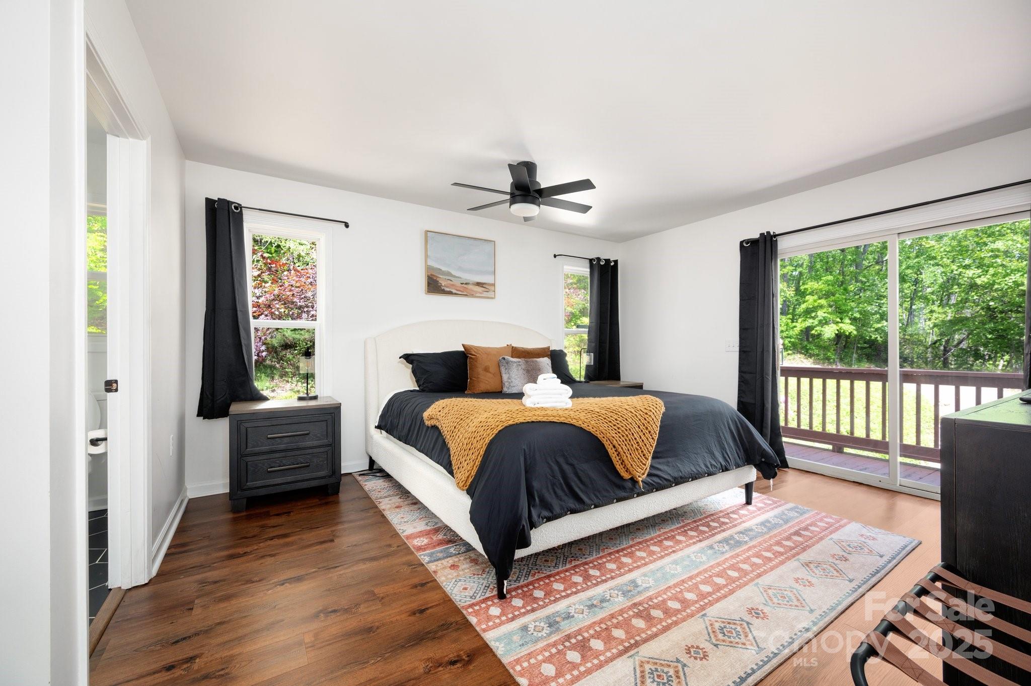 25 Lick Log Ridge Fairview, NC 28730 - Photo 17 of 34 a bedroom with a large bed and a window
