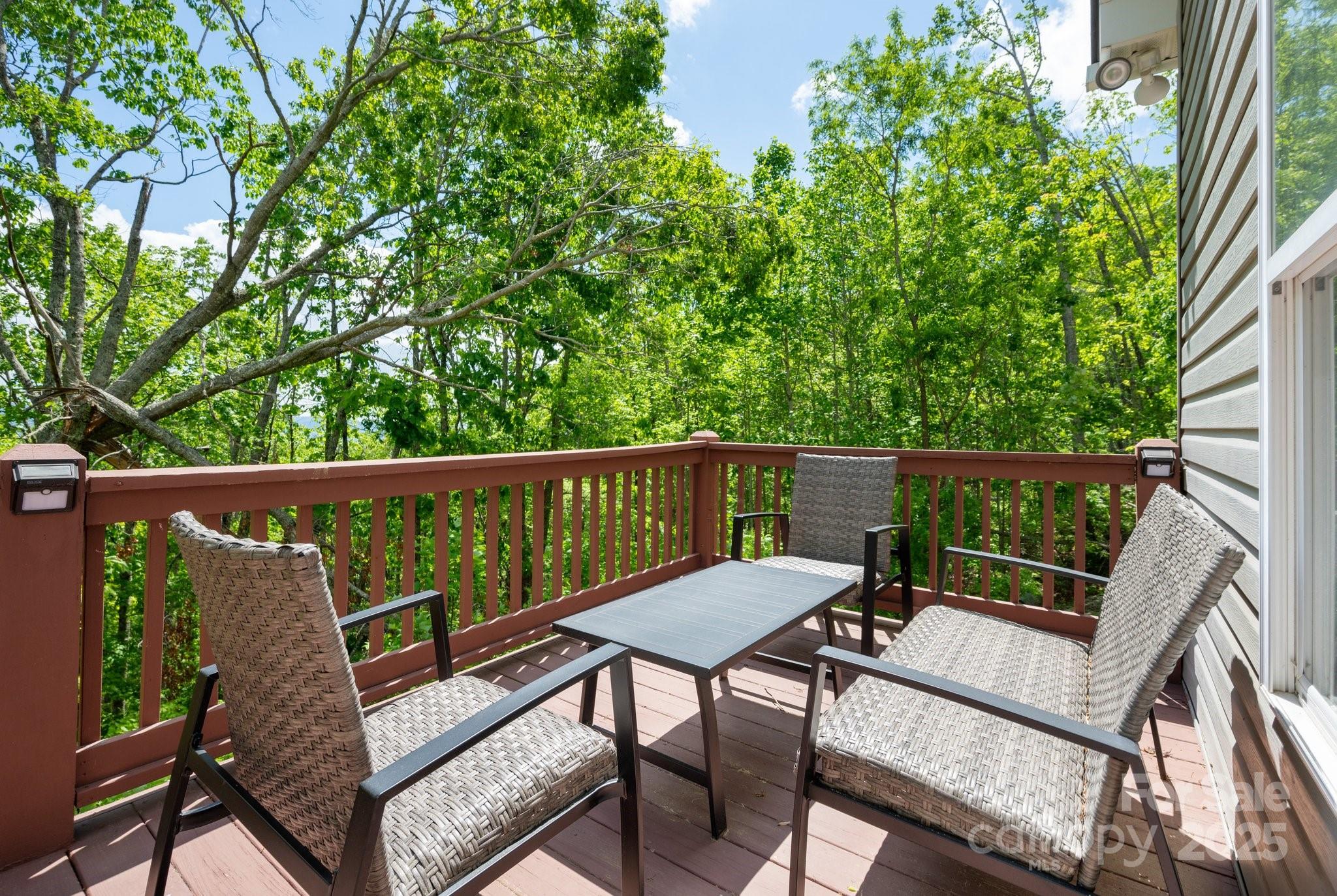 25 Lick Log Ridge Fairview, NC 28730 - Photo 19 of 34 a view of a two chairs in the deck