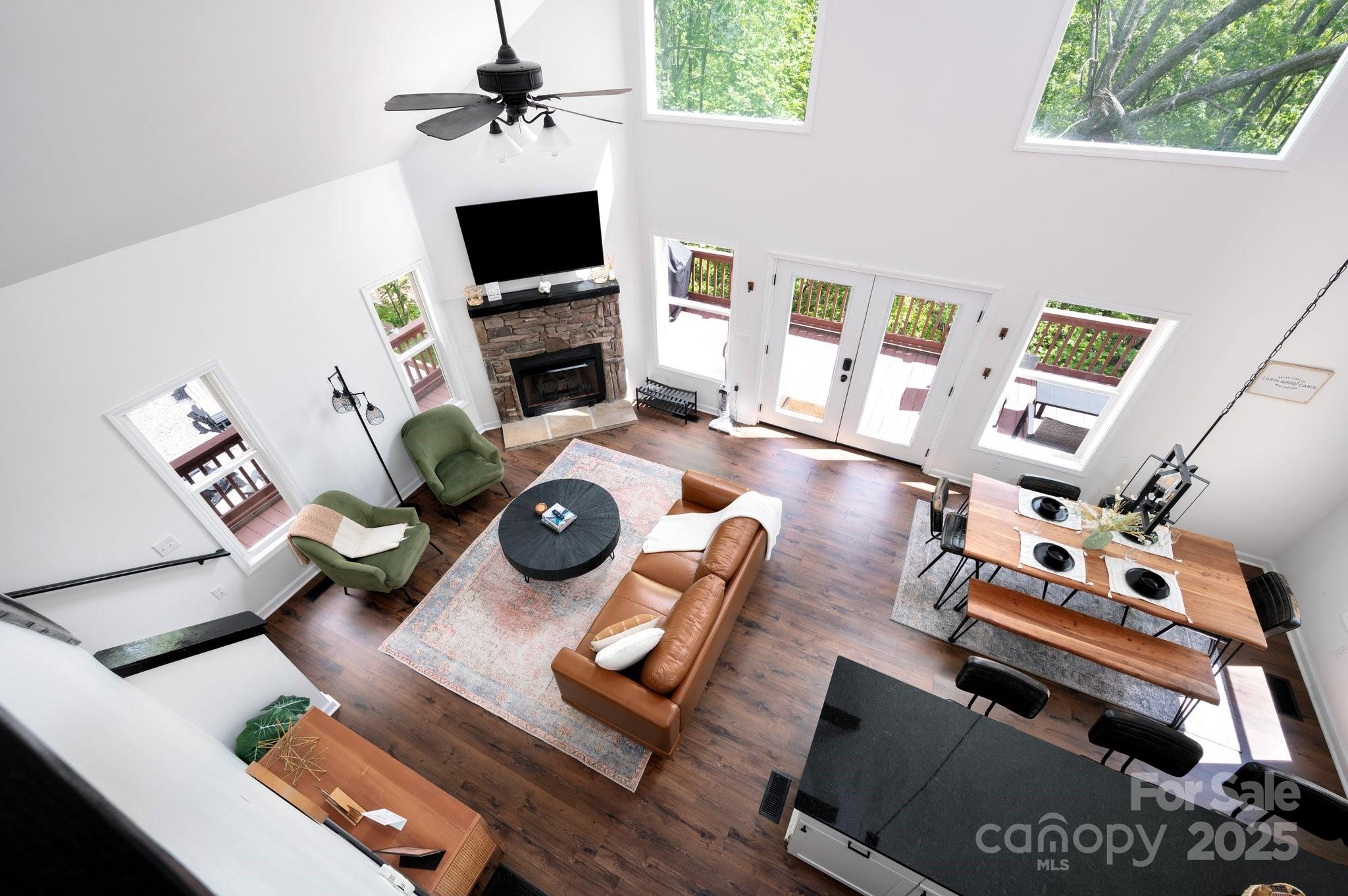 25 Lick Log Ridge Fairview, NC 28730 - Photo 21 of 34 a living room with furniture fireplace and a flat screen tv
