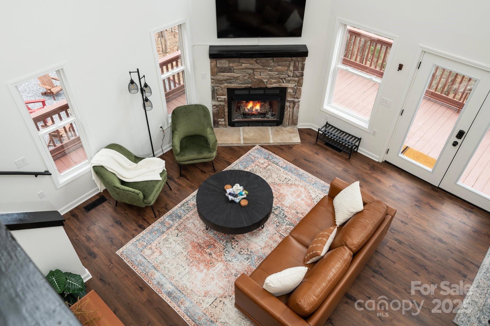 25 Lick Log Ridge Fairview, NC 28730 - Photo 22 of 34 a living room with furniture and a fireplace