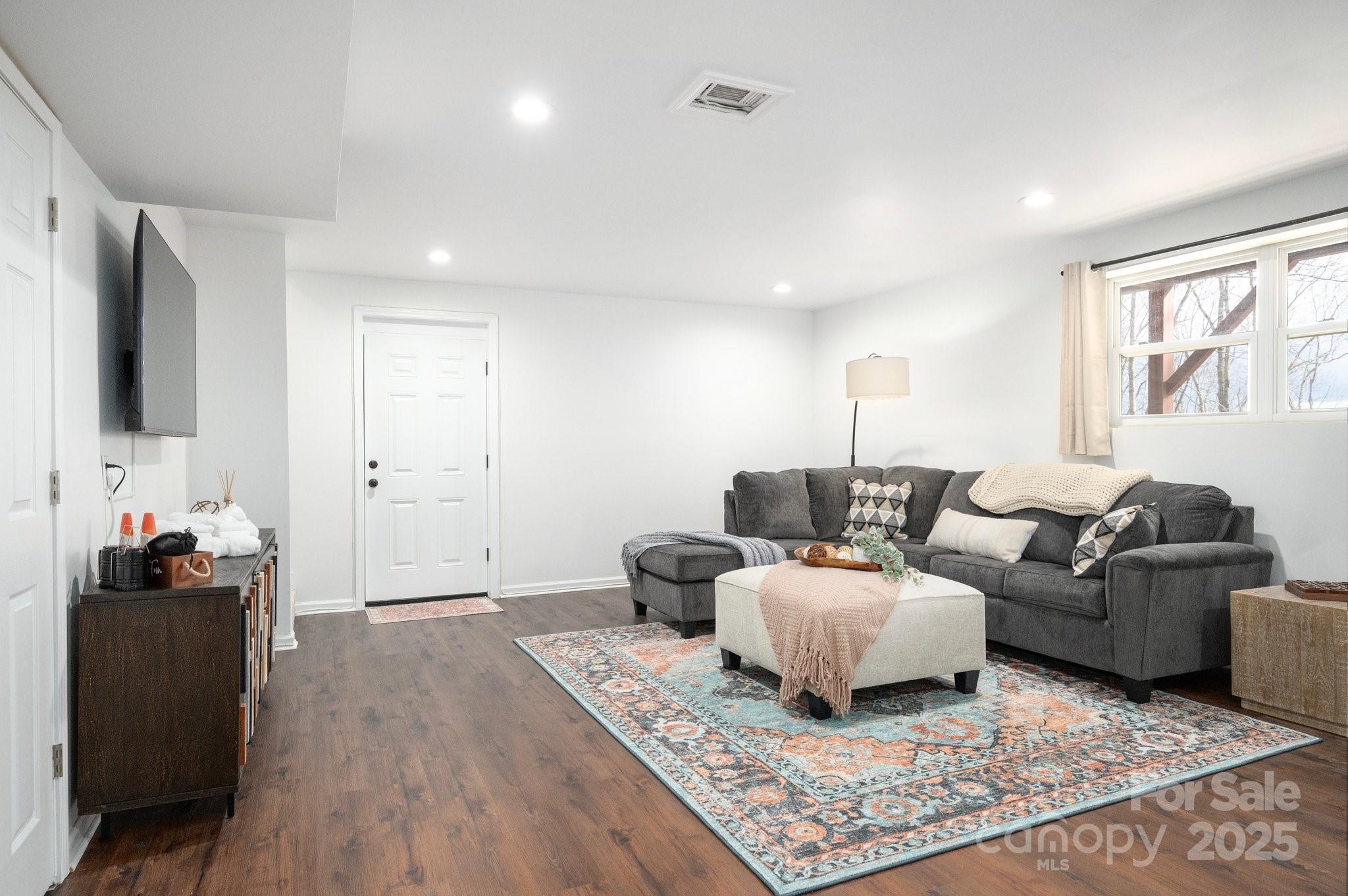 25 Lick Log Ridge Fairview, NC 28730 - Photo 29 of 34 a living room with furniture and a flat screen tv