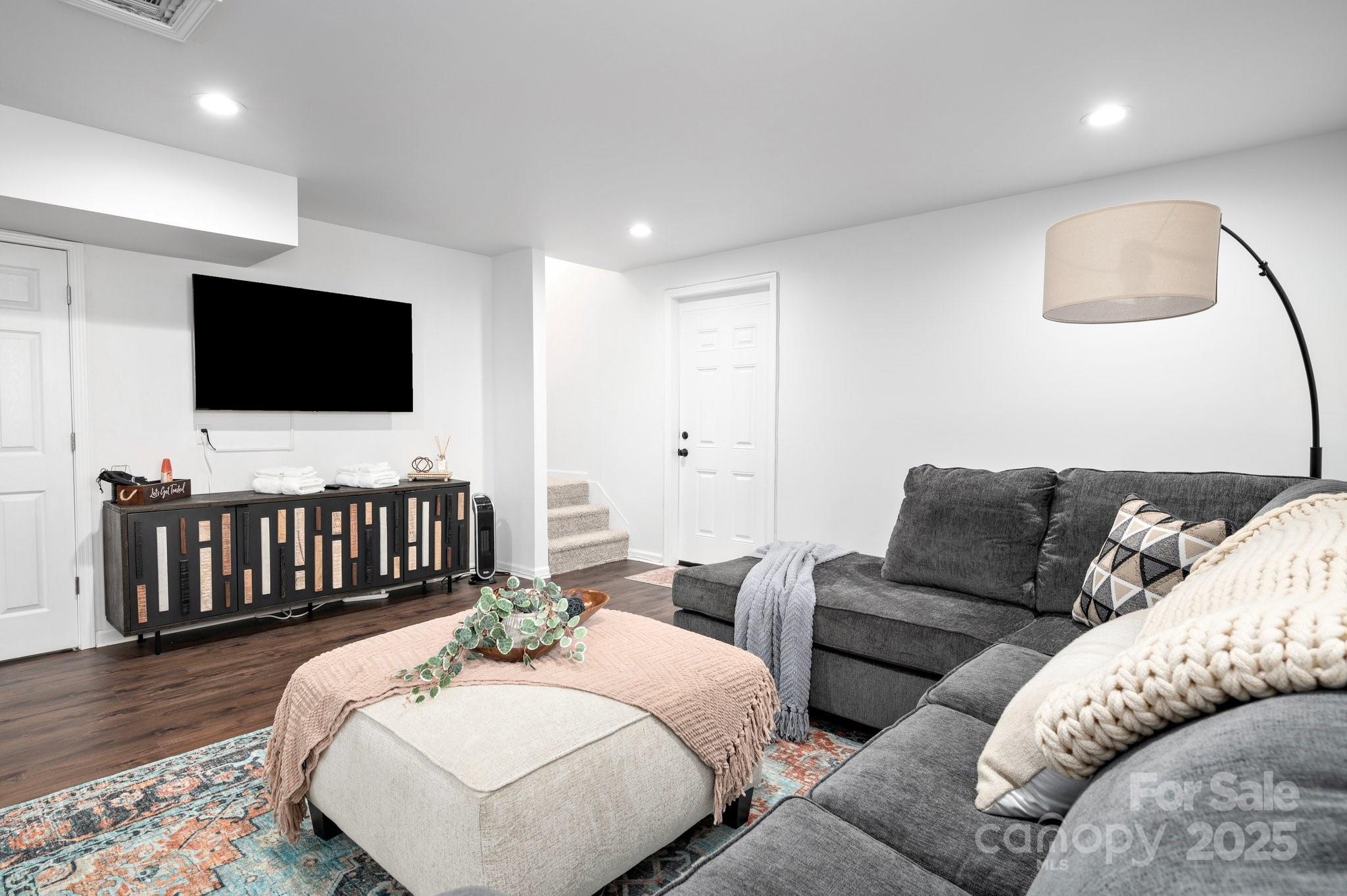 25 Lick Log Ridge Fairview, NC 28730 - Photo 30 of 34 a living room with furniture and a flat screen tv