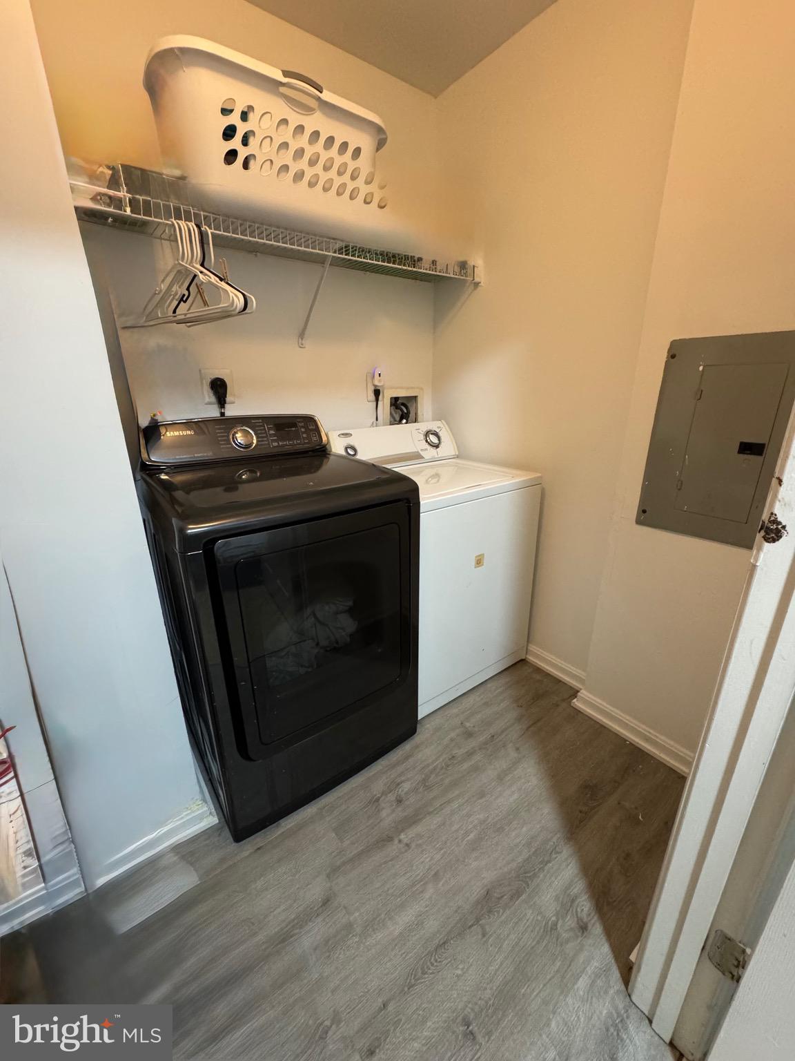 18310 Feathertree Way, Unit 101 Montgomery Village, MD 20886 - Photo 15 of 31 a utility room with dryer and washer