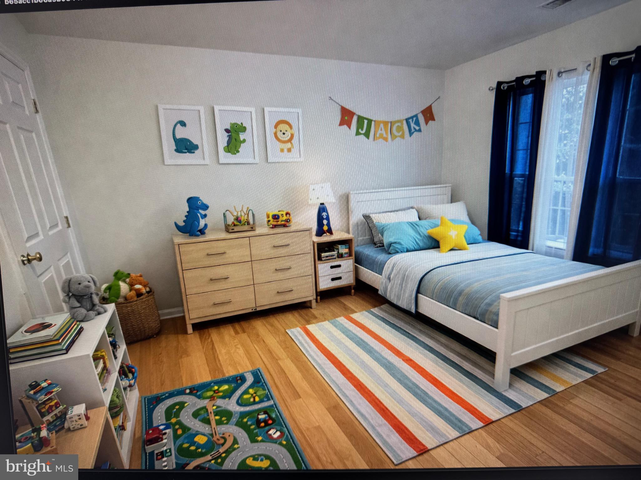 18310 Feathertree Way, Unit 101 Montgomery Village, MD 20886 - Photo 21 of 31 a bedroom with a bed and a window