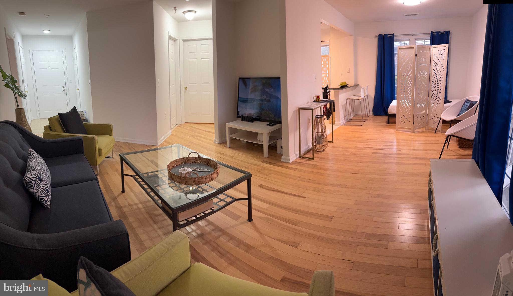 18310 Feathertree Way, Unit 101 Montgomery Village, MD 20886 - Photo 23 of 31 a living room with furniture
