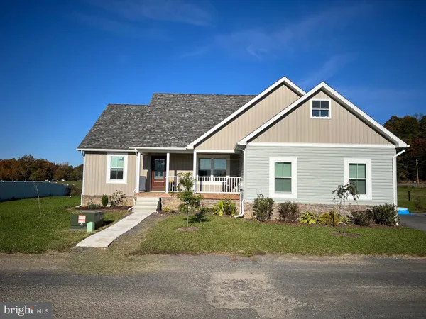 a front view of a house with yard