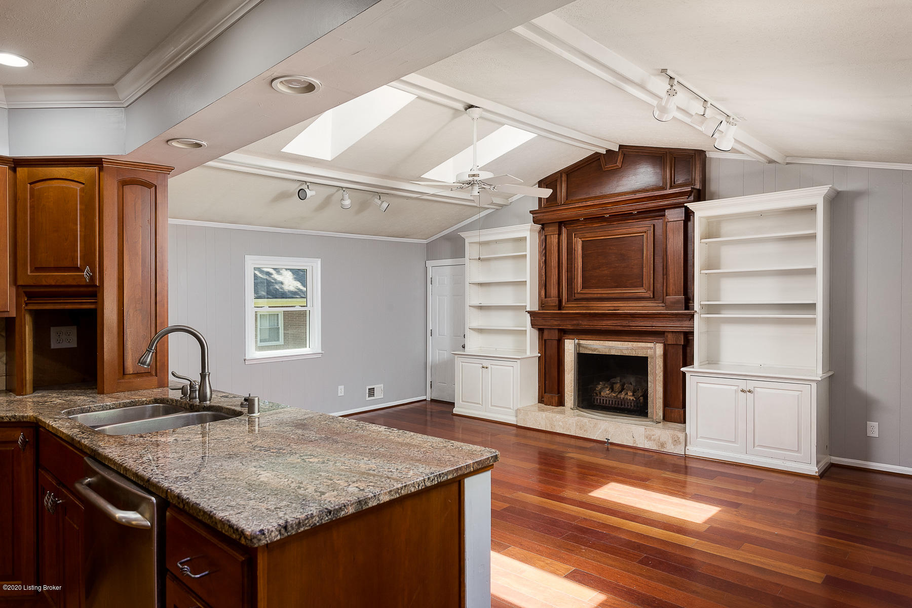 6803 Tottenham Road Louisville, KY 40207 - Photo 12 of 30 Kitchen overlooking the family room with fireplace and built in cabinetry