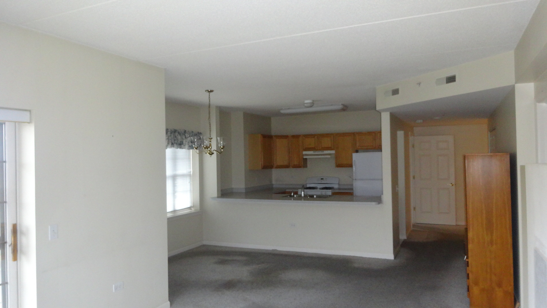 210 North Addison Avenue, Unit 401 Elmhurst, IL 60126 - Photo 16 of 30 a view of a kitchen with a window