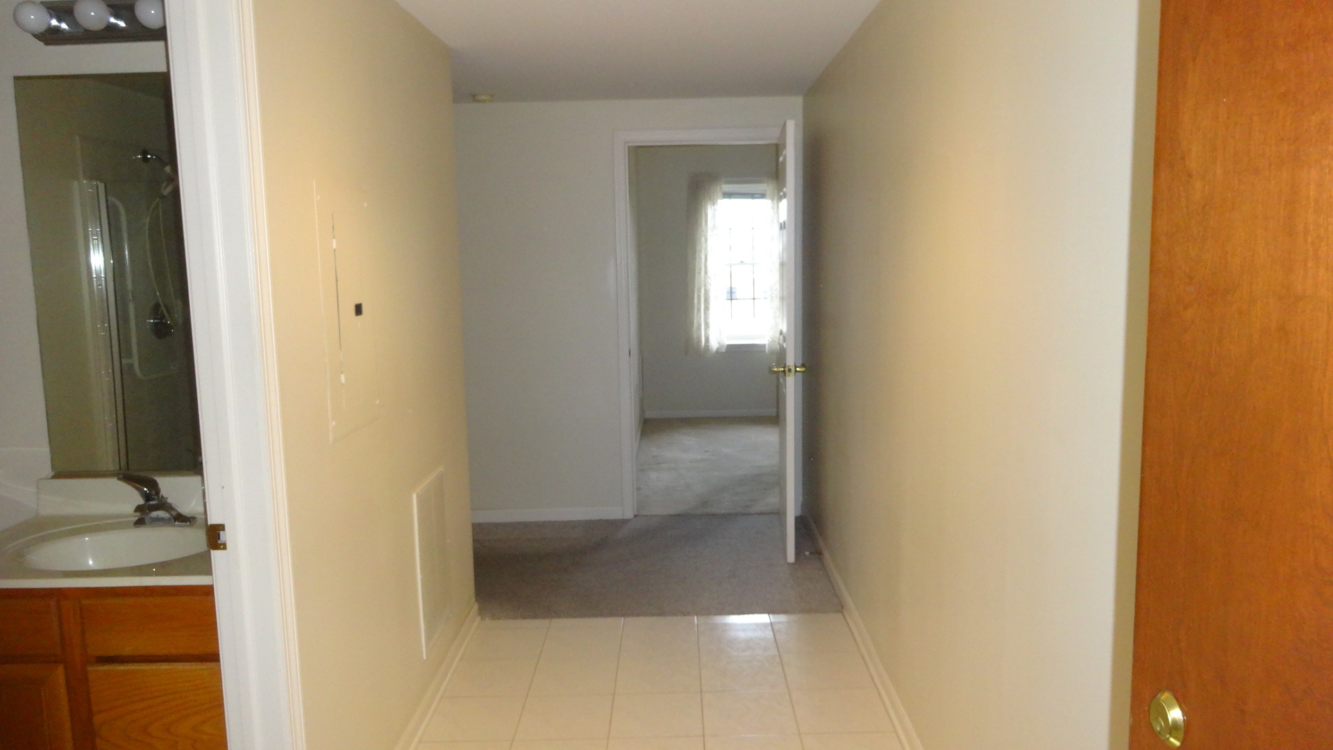 210 North Addison Avenue, Unit 401 Elmhurst, IL 60126 - Photo 5 of 30 a view of a bathroom from a corridor