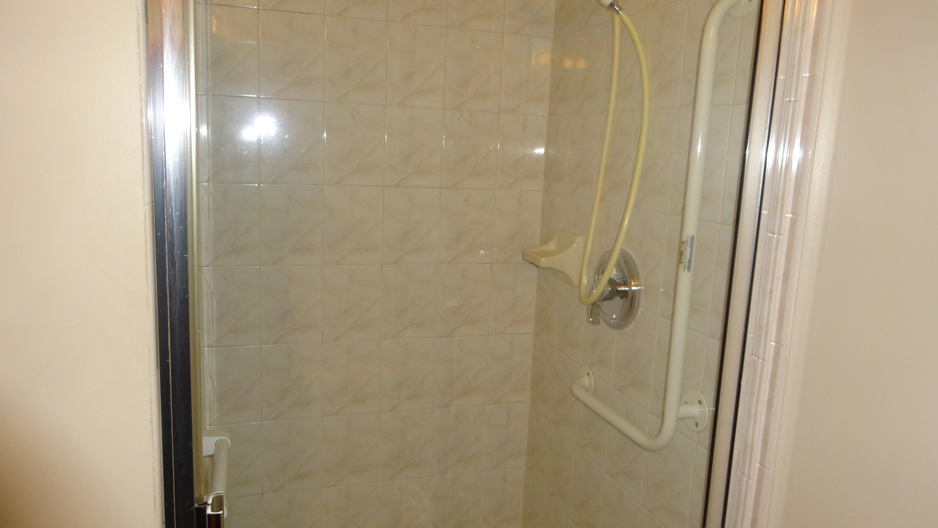 210 North Addison Avenue, Unit 401 Elmhurst, IL 60126 - Photo 8 of 30 a bathroom with a glass shower door