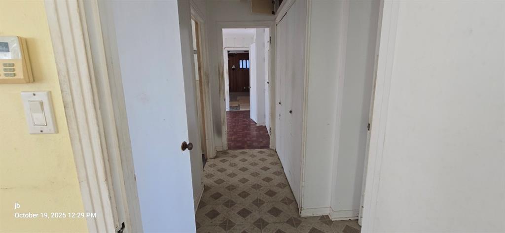 1314 South Azalea Drive Tyler, TX 75701 - Photo 14 of 27 a view of a hallway with white walls