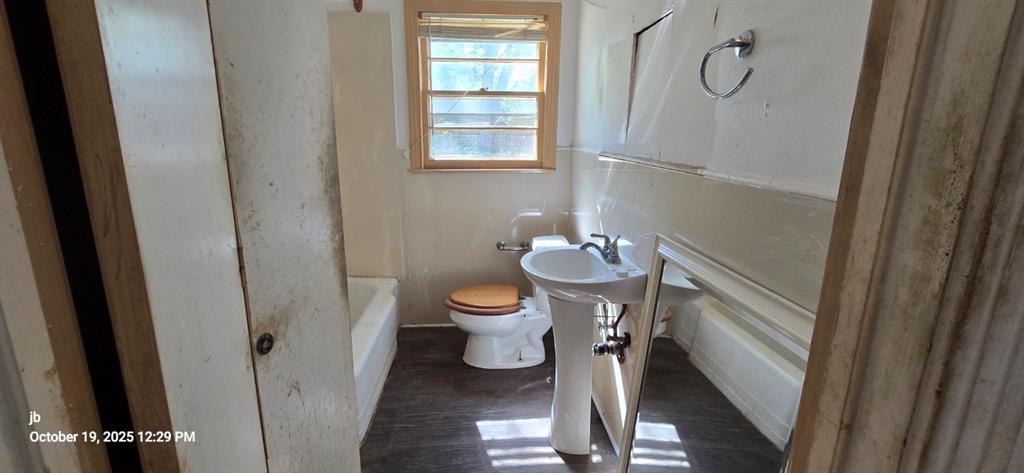 1314 South Azalea Drive Tyler, TX 75701 - Photo 15 of 27 a bathroom with a sink a toilet and shower