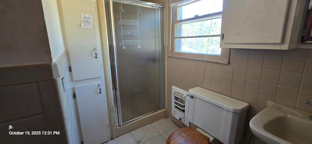 1314 South Azalea Drive Tyler, TX 75701 - Photo 22 of 27 a bathroom with a toilet and a sink