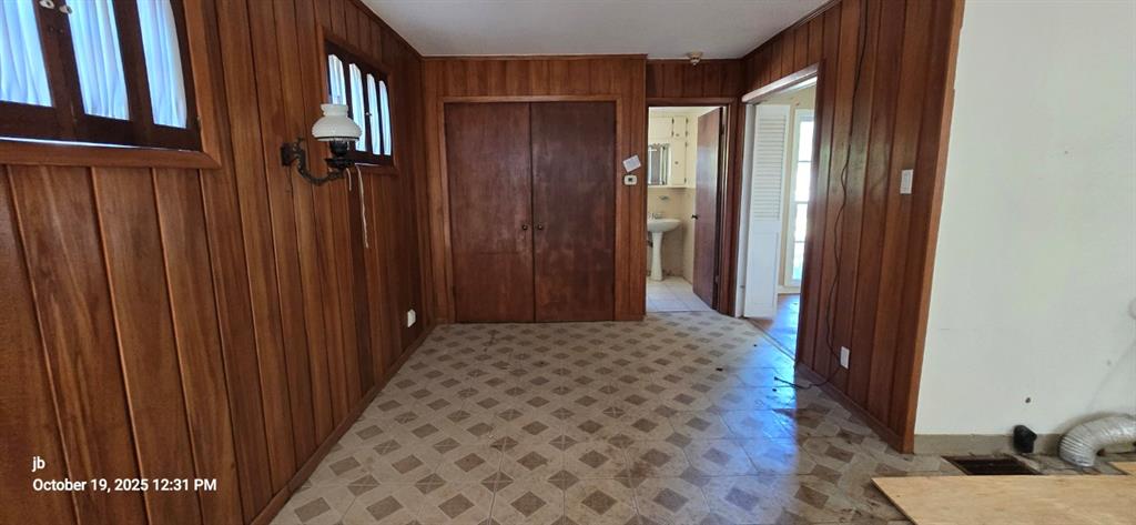 1314 South Azalea Drive Tyler, TX 75701 - Photo 24 of 27 a bedroom with a bed and wooden floor